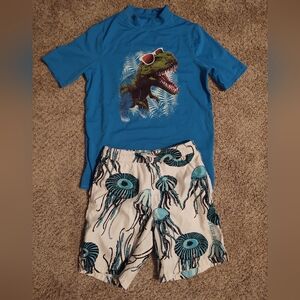 Large (14) swim shirt and medium swim shorts
